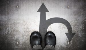 feet in front of two arrows different directions for career change