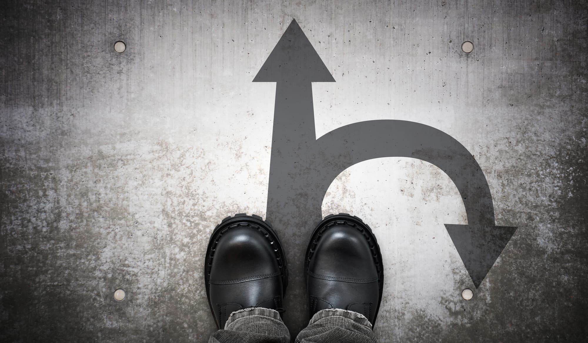 feet in front of two arrows different directions for career change