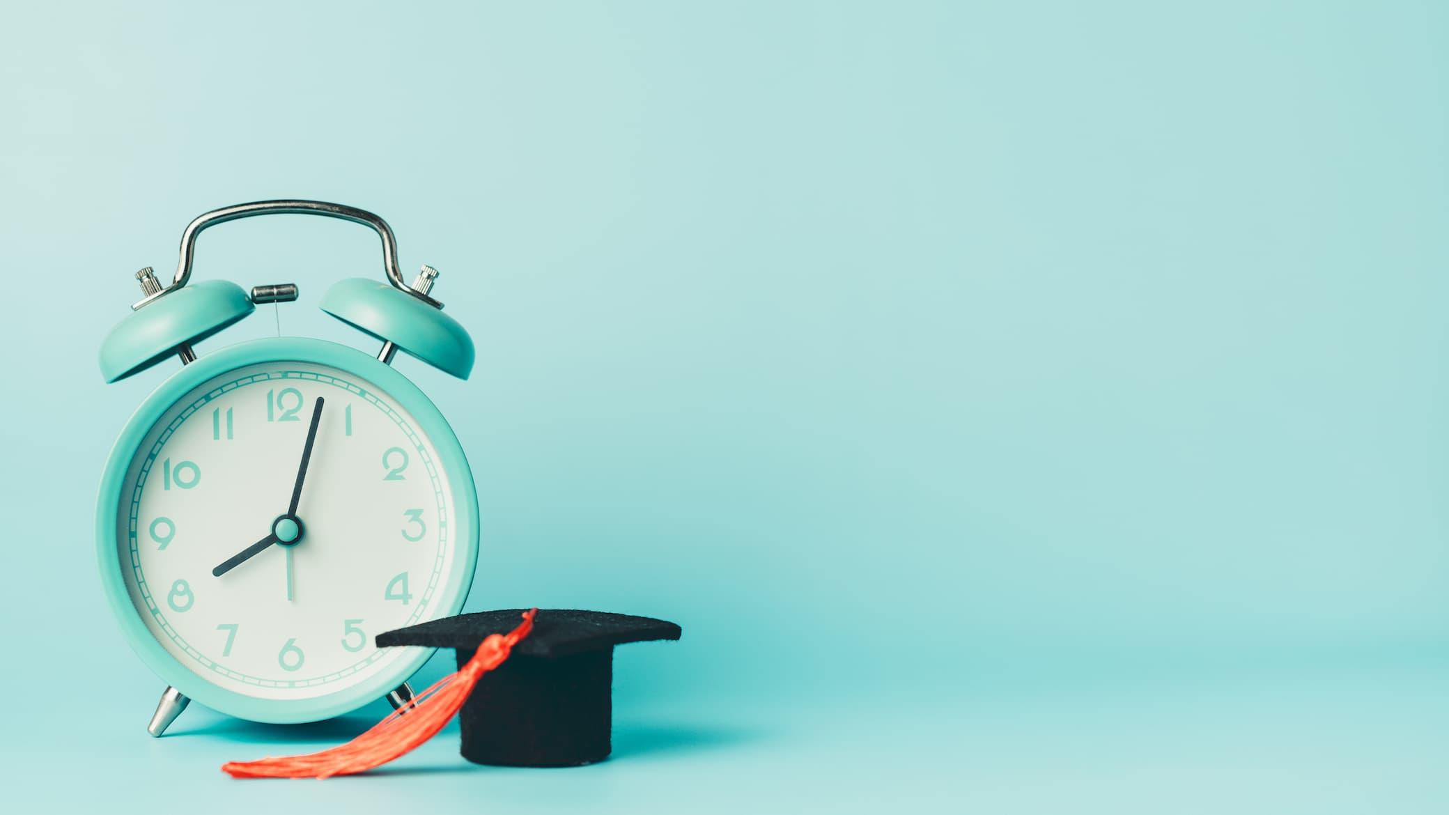 clock with graduation cap